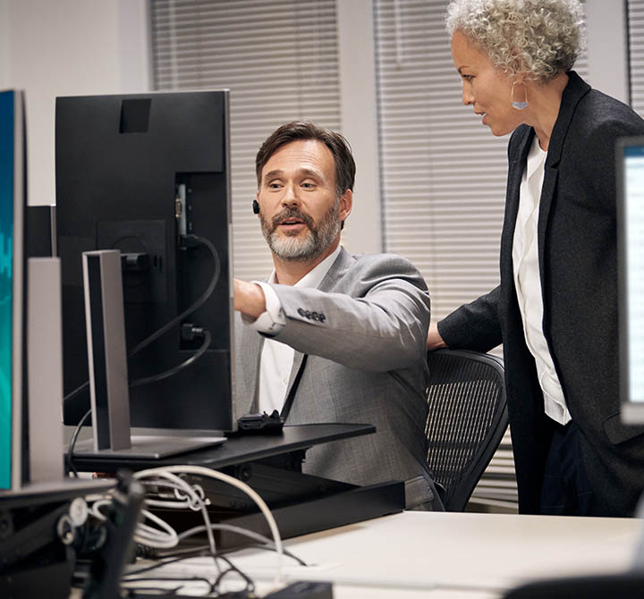 Man and woman discussion at desk